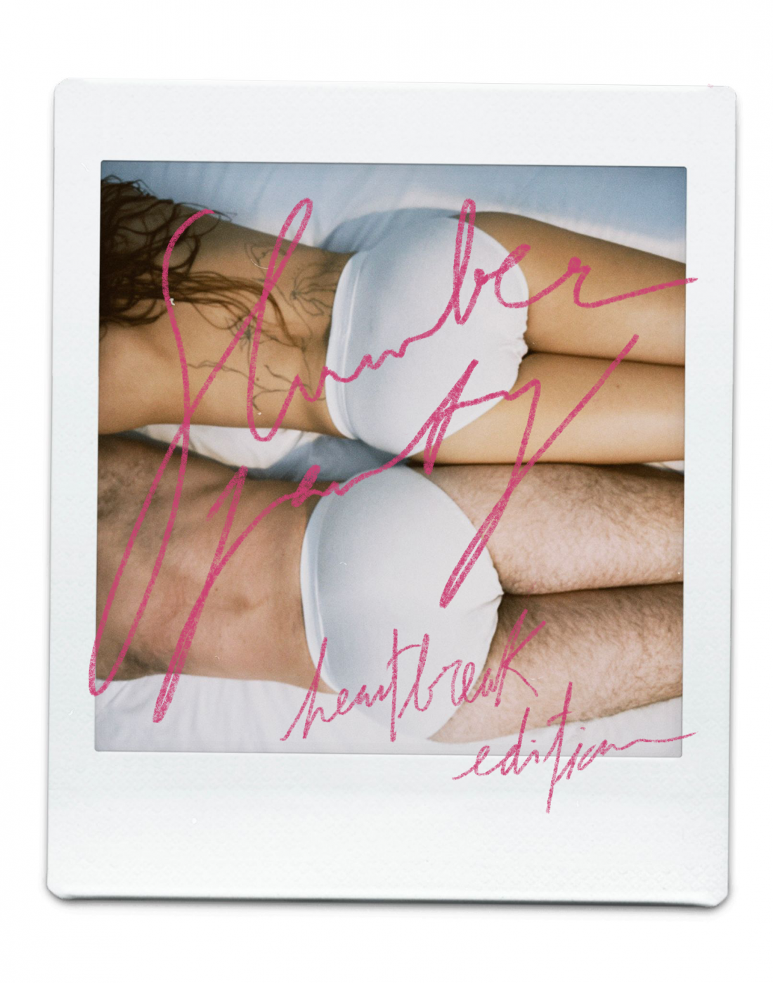 Color photograph. Two bodies lie on their backs on a white sheet, both wearing white underwear. Over the image, the name of the show appears, handwritten in pink.